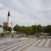 A view of Šiauliai, Lithuania featuring a prominent church and city square.